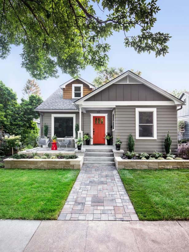 Small Cape Cod style rental home with a landscaped front yard